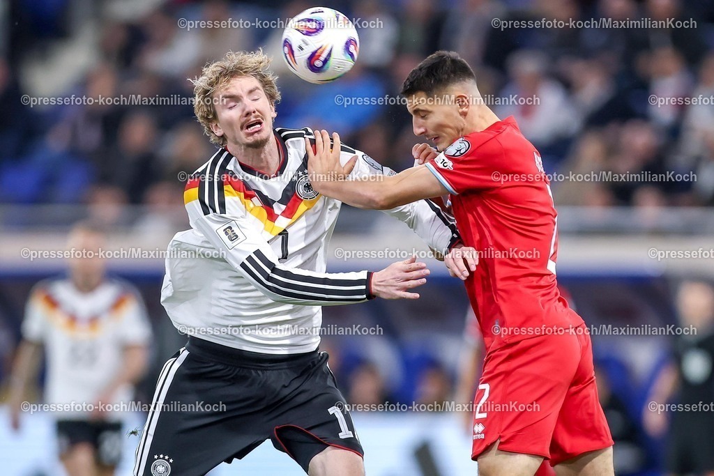 DFB14112501054 | 14.11.2025, Fußball, Länderspiel, WM-Qualifikation Europa, Deutschland - Luxemburg, Stade de Luxembourg (Croix de Gasperich, Luxemburg), 9. Spieltag, Saison 2025 2026: Nick Woltemade (GER #11) im Zweikampf gegen  Seid Korac (LUX #02)  Regulations prohibit any use of photographs as image sequences and or quasi-video.