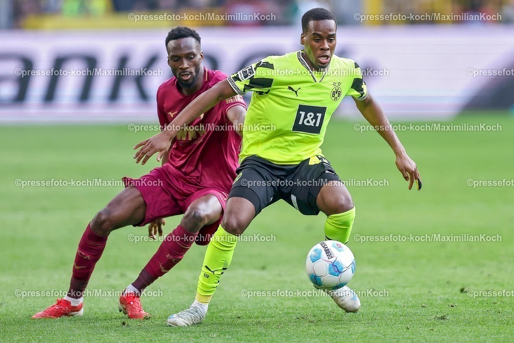 BVB08032501126 | 08.03.2025, Fußball, Borussia Dortmund - FC Augsburg, 1. Fußball Bundesliga, 25. Spieltag, Signal Iduna Park, Saison 2024 2025: Jamie Gittens (BVB #43) im Zweikampf gegen Chrislain Matsima (FC Augsburg #5)DFB regulations prohibit any use of photographs as image sequences and or quasi-video.