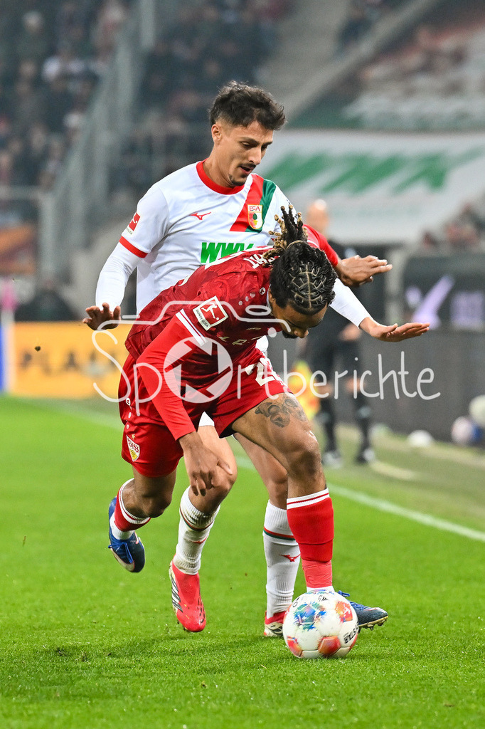 FC Augsburg - VfB Stuttgart | AUGSBURG, GERMANY - 22. MAERZ: im Duell Dimitrios GIANNOULIS (FC Augsburg 13) und Lorenz ASSIGNON (VfB Stuttgart 22) während dem Bundesligamatch zwischen dem FC Augsburg und dem VfB Stuttgart am 27. Spieltag in der WWK Arena / DFL REGULATIONS PROHIBIT ANY USE OF PHOTOGRAPHS AS IMAGE SEQUENCES AND/OR QUASI-VIDEO