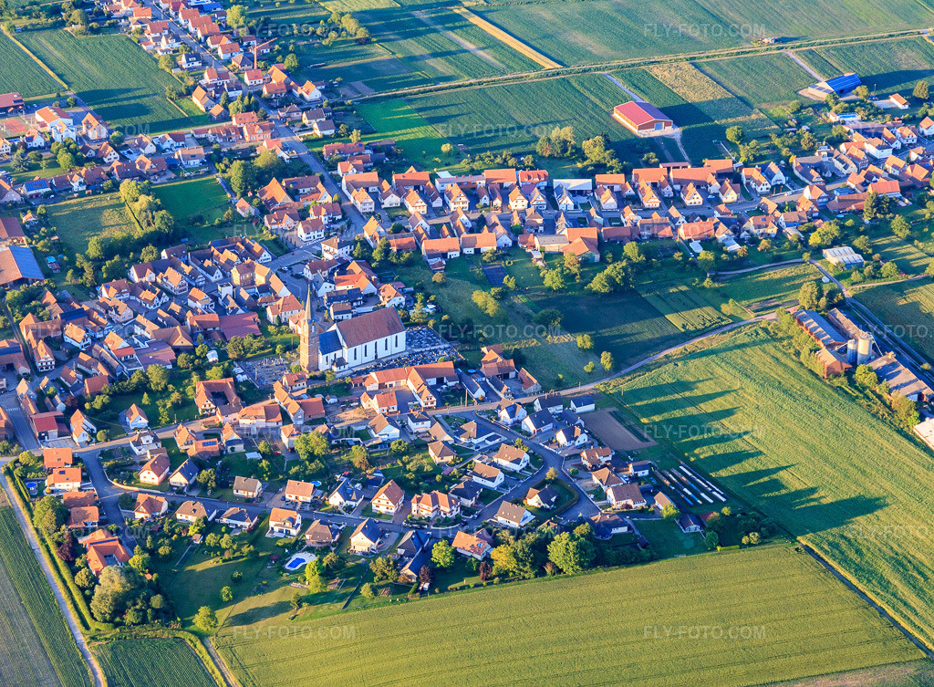 Aerial view: Village overview from the southwest in Schleithal in the state Bas-Rhin, France. – Photo: IMG_115544.jpg taken on 06/16/2019 by Werner Riehm/FLY-FOTO.com – Resolution of the original: 4725 x 3474 px