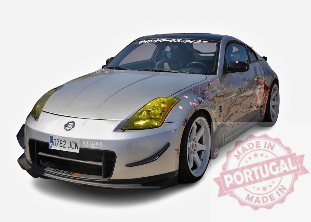 Tuned Nissan 350Z showcasing its Itasha Livery and Aftermarket Parts | Silver Nissan 350Z featuring a vibrant Itasha-style car wrap with cherry blossoms and anime characters, alongside aftermarket modifications - Realisiert mit Pictrs.com