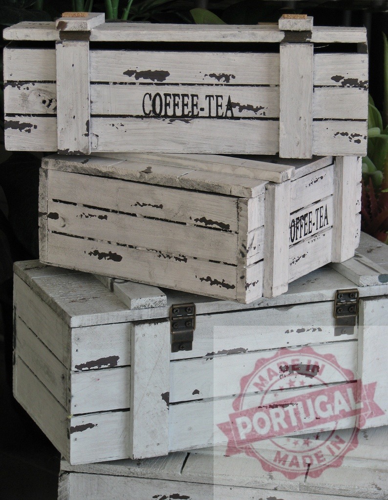 Stacked vintage distressed white wooden coffee tea boxes | Stacked distressed white wooden boxes for coffee and tea storage - Realized with Pictrs.com