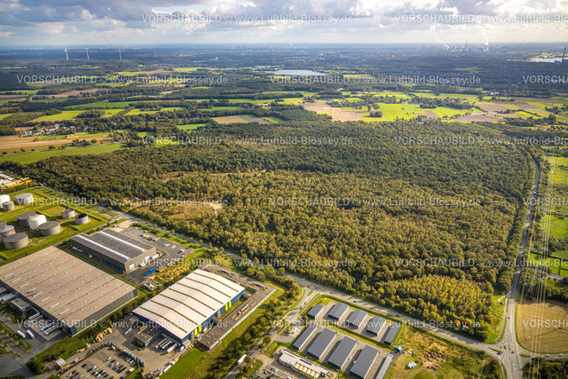Huenxe241009833 | Luftbild, Industrie- und Gewerbepark Hünxe Bucholtwelmen-West mit Garagen Anlage Otto-Hahn-Straße und HotWash Hünxe, Waldgebiet FFH Naturschutzgebiet Kaninchenberge, Fernsicht und blauer Himmel mit Wolken,  Bucholtwelmen, Hünxe, Niederrhein, Nordrhein-Westfalen, Deutschland