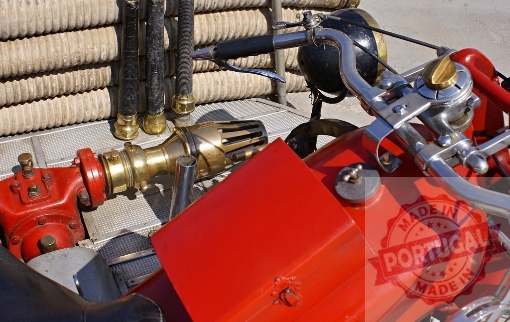 Vintage fire fighting equipment details with nozzles and hoses | Details of vintage fire department equipment featuring red and brass elements - Realized with Pictrs.com