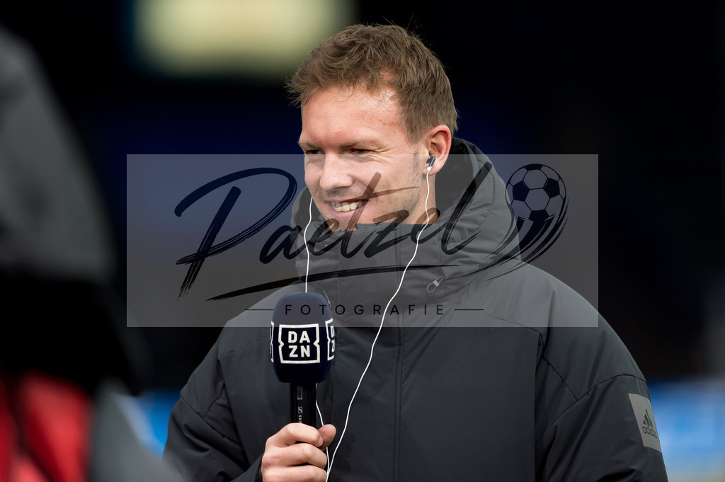 BSCFCB20220123_044 | Fussball, Herren: Trainer Julian Nagelsmann (FC Bayern Muenchen) im Interview bei dem Spiel der 1. Bundesliga zwischen Hertha BSC und FC Bayern Muenchen im Olypiastadion am 23.01.2022 in Berlin, Deutschland.DFB / DFL REGULATIONS PROHIBIT ANY USE OF PHOTOGRAPHS AS IMAGE SEQUENCES AND/OR QUASI-VIDEO. - Realisiert mit Pictrs.com