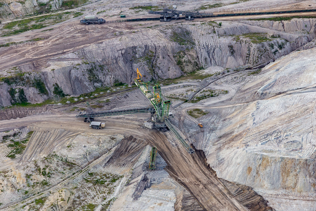 Aerial view: Conveyor excavator in the brown coal opencast mine 