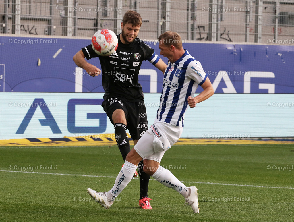 A_LUI_191024_05 | SPORT,FUSSBALL,ADMIRAL BUNDESLIGA BLAU WEISS LINZ-RZ PELLETS WAC 19.10.2024 IM BILD :THOMAS GOIGINGER  (BL.WEISSLINZ) UND DOMINIK BAUMGARTNER  (WAC) FOTOLUI/MW