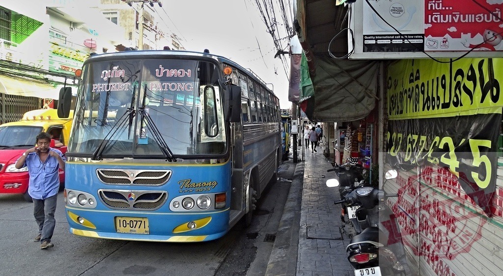 Blue and Yellow Bus Parked on Phuket Street, Thailand | Blue and yellow bus with destination Phuket and Patong parked on a busy street in Thailand - Realized with Pictrs.com