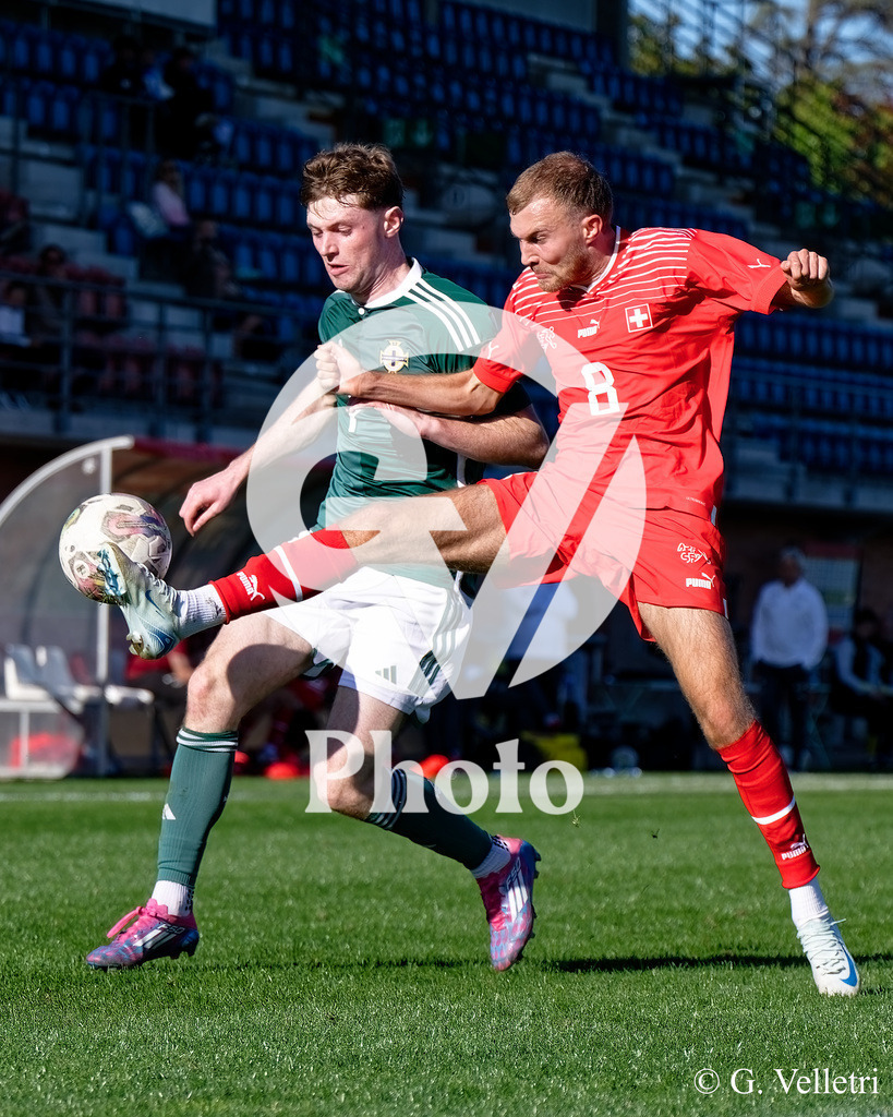 UEFA Region's Cup - NI Western Region v Vaud | Johannes Schwab (8 Vaud) and Darragh Byrne (7 NI Western Region) battle for the ball (duel) during the UEFA Region's Cup game between NI Western Region and Vaud at Centre Sportif de Colovray in Nyon, Switzerland 