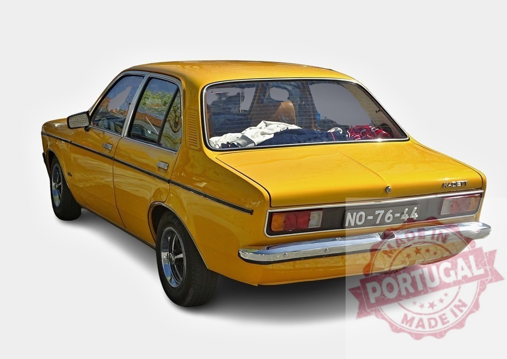 Yellow Opel Kadett B parked, showing rear side, with clothes on rear seats | Classic Opel Kadett B car parked, showing its rear side, with clothes on rear seats - Realized with Pictrs.com