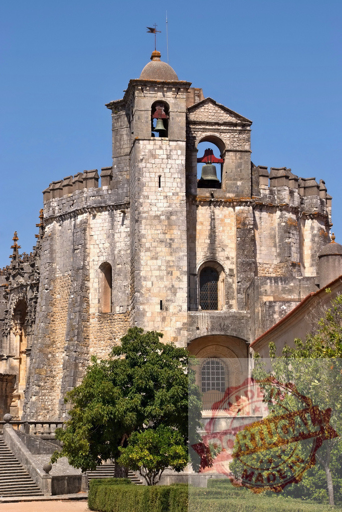 Convent of Christ bell tower and stone walls in Tomar | Convent of Christ, a UNESCO World Heritage Site, displaying ancient stone architecture under a clear blue sky - Realized with Pictrs.com