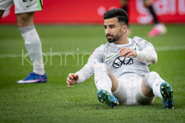 German Bundesliga, Bayer 04 Leverkusen vs. VfL Wolfsburg, 04.04.2026 | LEVERKUSEN, GERMANY - APRIL 4, 2026 :  Mohammed Amoura (VfL Wolfsburg, 9) sitting in the grass during the German Bundesliga match on gameday 28 between Bayer 04 Leverkusen vs. VfL Wolfsburg at BayArena on April 4, 2026 in Leverkusen, Germany. DFL REGULATIONS PROHIBIT ANY USE OF PHOTOGRAPHS AS IMAGE SEQUENCES AND/OR QUASI-VIDEO.