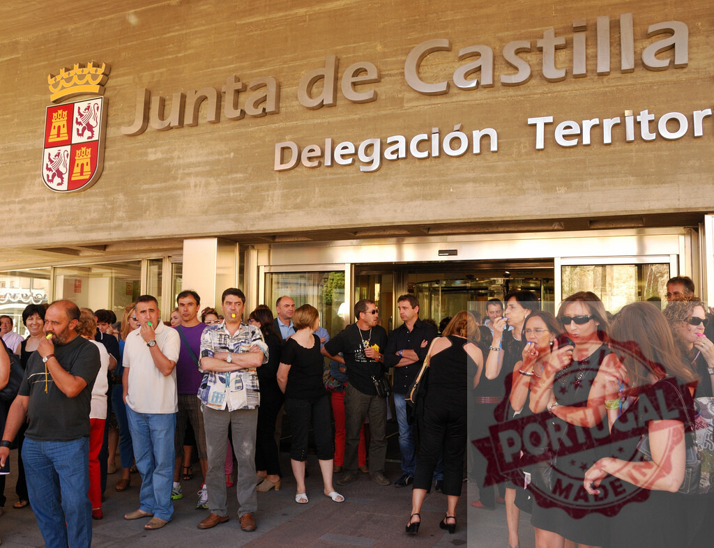 People with whistles participating in a public protest in Spain | Demonstrators protesting in front of Junta de Castilla y León building - Realized with Pictrs.com