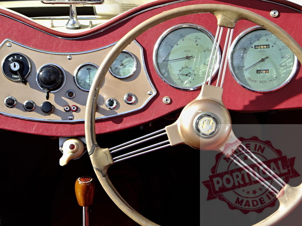 Dashboard and steering wheel of a vintage MG sports car | Close-up of the dashboard and steering wheel of a classic MG roadster, showcasing its vintage charm and intricate details - Realized with Pictrs.com