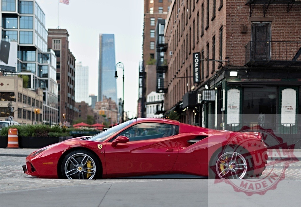 Red Ferrari sports car parked on a New York City street | Red Ferrari sports car displaying luxury and urban lifestyle on a city street - Realized with Pictrs.com