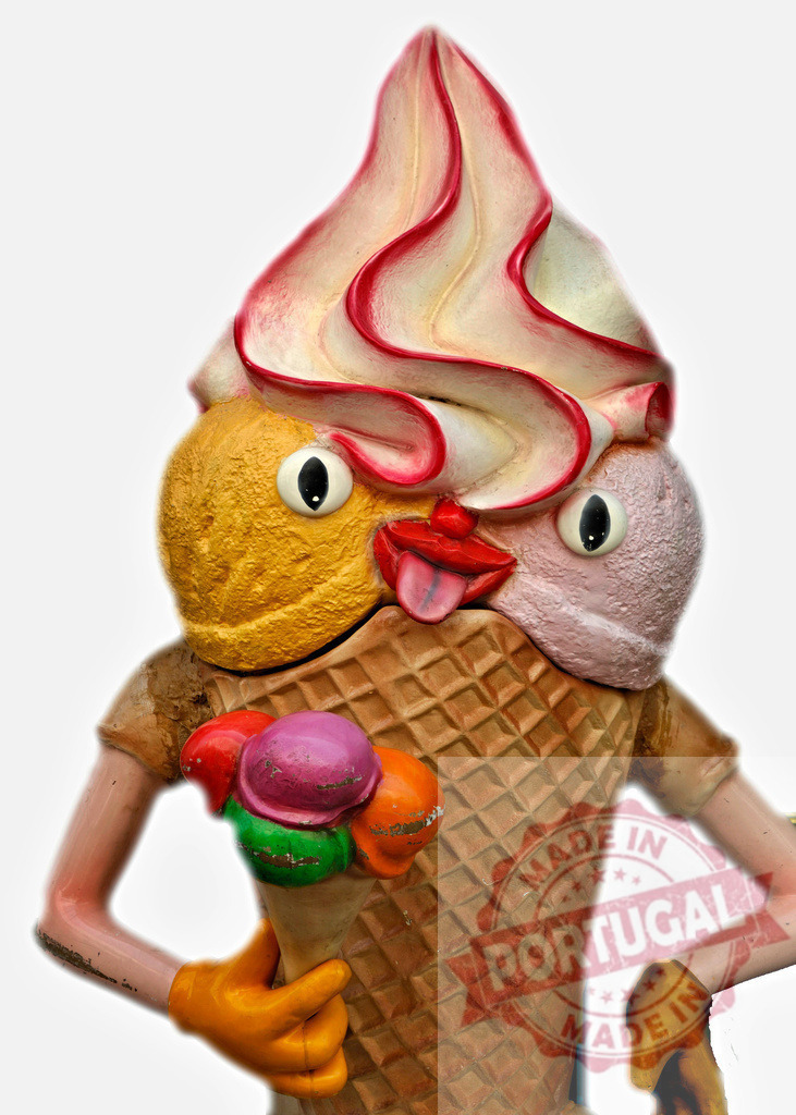 Anthropomorphic ice cream cone holding a small cone | Whimsical ice cream cone character with a tongue sticking out, holding a small multi-scoop cone - Realisiert mit Pictrs.com