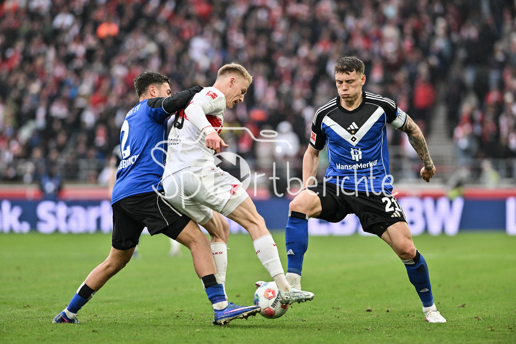 VfB Stuttgart - Hamburger SV | STUTTGART, GERMANY - 12. APRIL: tackle between William MIKELBRENCIS (Hamburger SV 2) and Chris FÜHRICH (VfB Stuttgart 10) and Nicolai REMBERG (Hamburger SV 21) during the Bundesliga Match between VfB Stuttgart vs. Hamburger SV on Matchday 29 at MHP Arena / DFL REGULATIONS PROHIBIT ANY USE OF PHOTOGRAPHS AS IMAGE SEQUENCES AND/OR QUASI-VIDEO