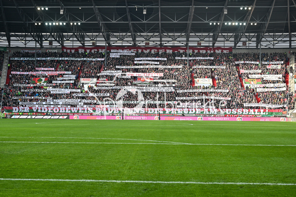 FC Augsburg - 1. FC Heidenheim | AUGSBURG, GERMANY - 15. FEBRUARY: Fans der Augsburger zeigen zu Spielbeginn Spurchbänder / VAR Abschaffen / Symbolbild / Symbolfoto / während dem Bundesligamatch zwischen dem FC Augsburg und dem 1. FC Heidenheim am 22. Spieltag in der WWK-Arena / DFL REGULATIONS PROHIBIT ANY USE OF PHOTOGRAPHS AS IMAGE SEQUENCES AND/OR QUASI-VIDEO
