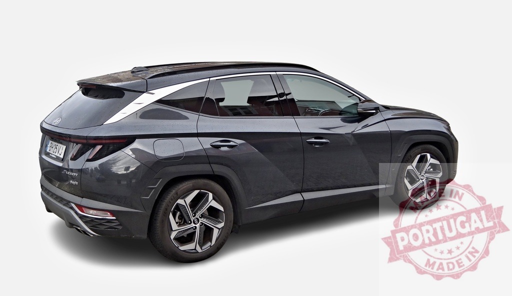 Modern SUV parked, highlighting its sleek profile and dynamic lines | Hyundai Tucson N Line showcasing its elegant design and sporty features - Realized with Pictrs.com