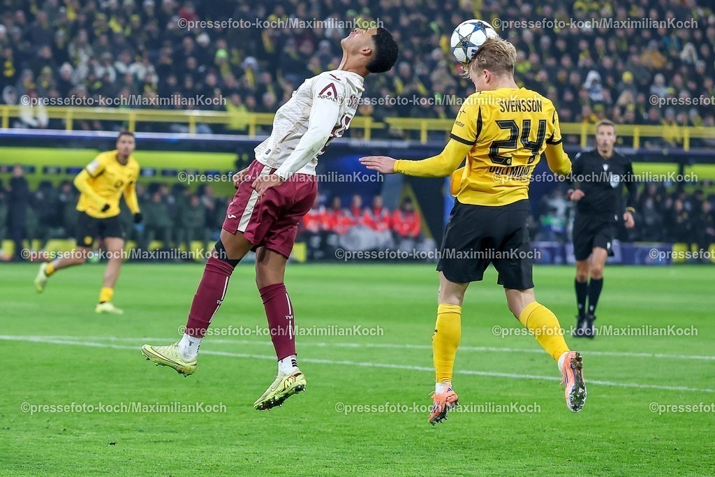 UCL25112502177 | 25.11.2025, Fußball, UEFA Champions League, Borussia Dortmund - FC Villarreal, BVB Stadion, 5. Spieltag, Saison 2025 2026: Santiago Mourino (FC Villarreal #15) im Zweikampf gegen  Daniel Svensson (BVB #24) beim Kopfball Kopfballduell  Regulations prohibit any use of photographs as image sequences and or quasi-video.