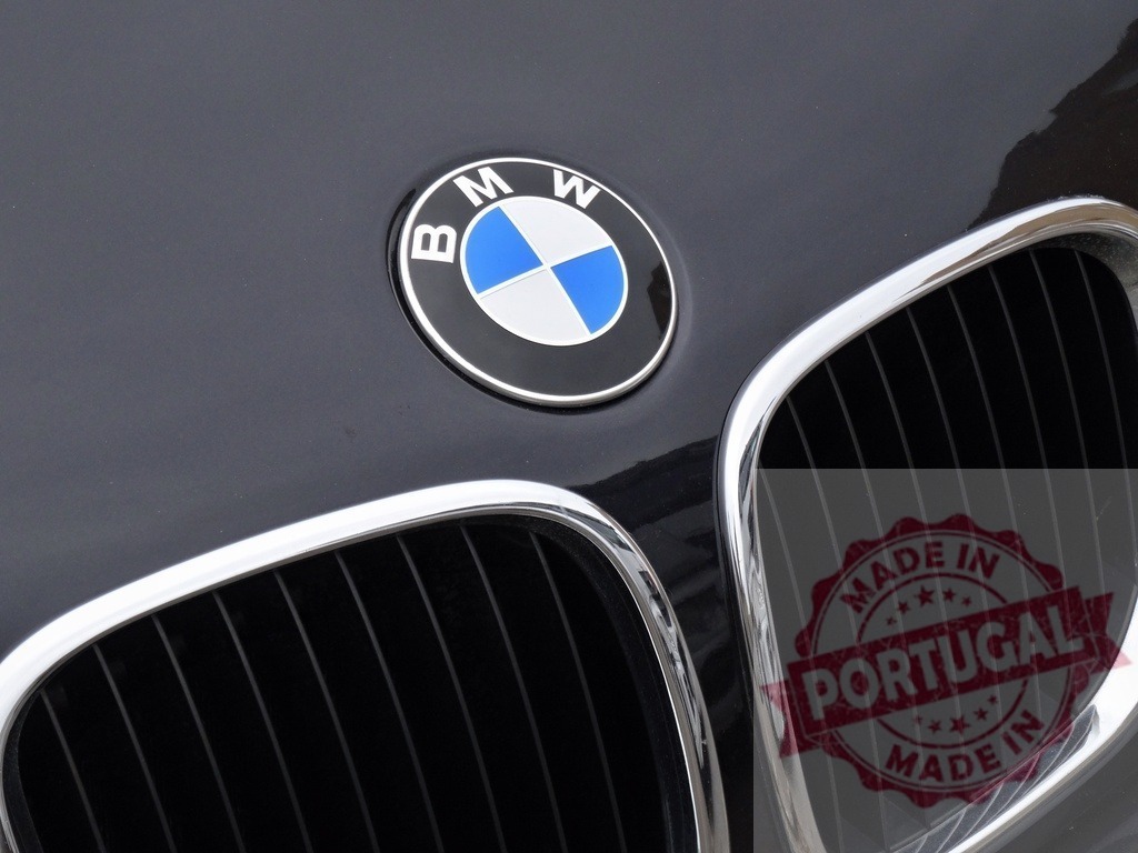 BMW car logo and chrome grill on hood | BMW emblem and front grill representing luxury automotive design and German engineering - Realized with Pictrs.com