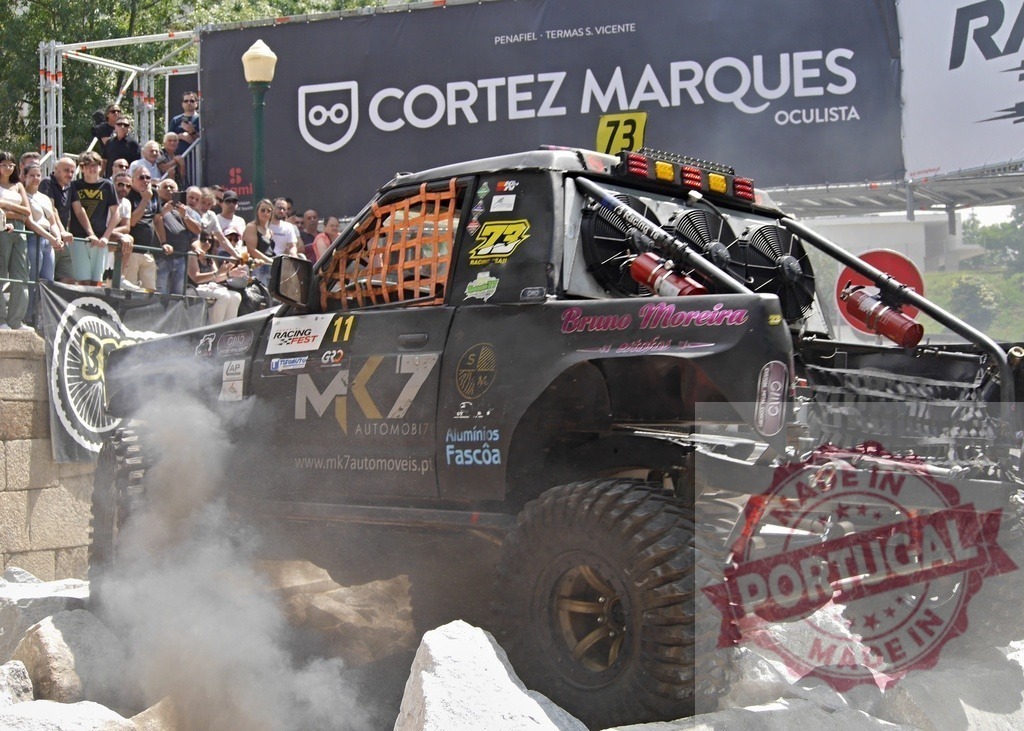 4x4 truck competing in an offroad race, kicking up dust and rocks | Powerful offroad truck participating in a race, generating a cloud of dust while driving over rocks - Realized with Pictrs.com