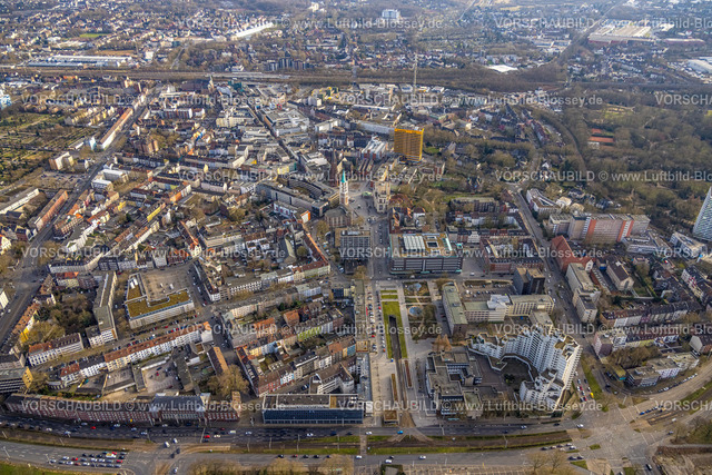 Gelsenkirchen250203100Sued | Luftbild, City Innenstadtansicht mit Heinrich-König-Platz, Ebertstraße mit Straßenbahnunterführung, CityHochhaus, und Bahnhofstraße, kath. Propsteikirche St. Augustinus und evang. Emmaus Altstadtkirche, gelbes Hochhaus Hamburg-Mannheimer Jobcenter Agentur für Arbeit, Altstadt, Gelsenkirchen, Ruhrgebiet, Nordrhein-Westfalen, Deutschland