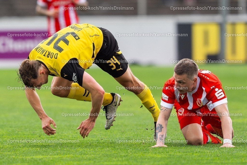 xydr13042501099 | 13.04.2025, xydrx, Fußball, Borussia Dortmund II - FC Energie Cottbus, 3.Liga, Stadion Rote Erde, Saison 2024 2025: Erik Engelhardt (FC Energie Cottbus #18) im Zweikampf gegen Yannik Luehrs (Borussia Dortmund II #34) DFB regulations prohibit any use of photographs as image sequences and or quasi-video.
