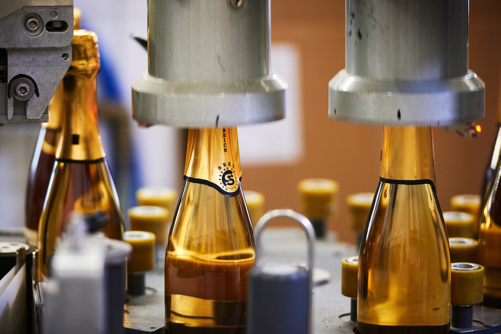 Sektkellerei Szigeti | Gols, Austria - February 19, 2018: Sektkellerei Szigeti; mehrere Sektflaschen mit Sektkappen.  - Realisiert mit Pictrs.com