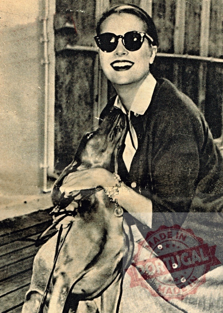 Grace Kelly enjoys the company of a seal | Grace Kelly smiling and hugging a seal while wearing sunglasses - Realized with Pictrs.com