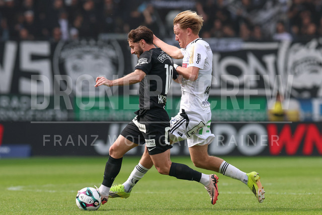 SK Puntigamer Sturm Graz vs TSV Egger Glas Hartberg – Championship Group    | Graz, Austria, 12.Apr.26 - SOCCER - ADMIRAL Bundesliga, SK Puntigamer Sturm Graz vs TSV Egger Glas Hartberg. The image shows Otar Kiteishvili (STU) and Benjamin Markus (Hartberg).    