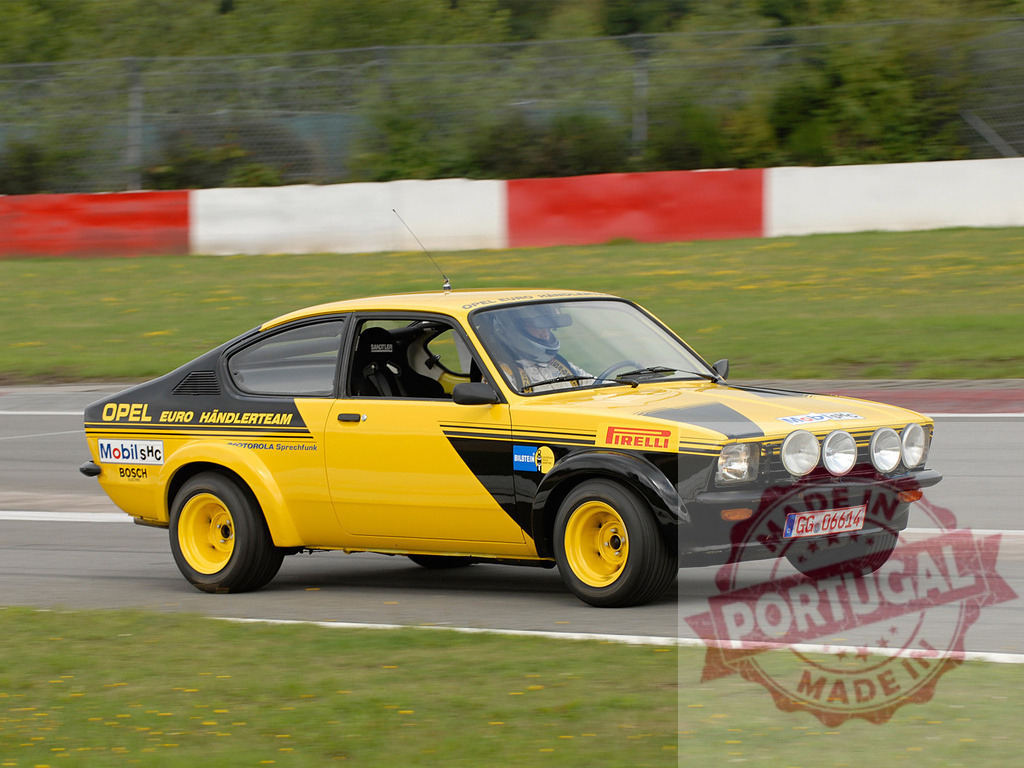 Opel Kadett C Coupe racing on a track during a competition | Yellow Opel Kadett C Coupe speeding on a racetrack during a vintage car competition - Realized with Pictrs.com