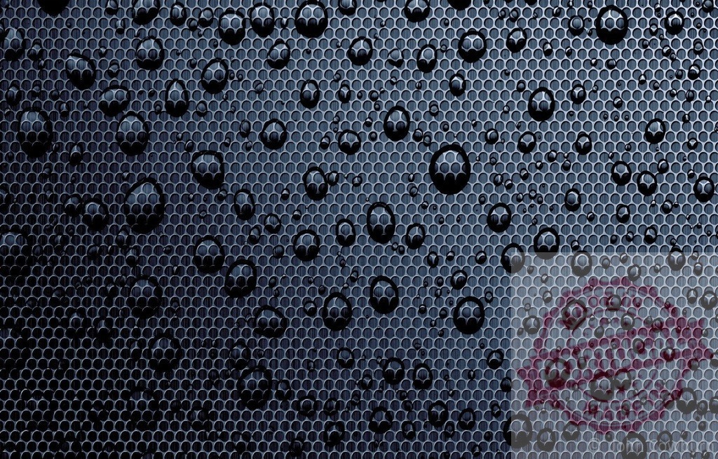 Water droplets resting on dark metallic textured surface | Close-up of water droplets on a dark metallic textured surface, creating a visually appealing abstract pattern - Realized with Pictrs.com