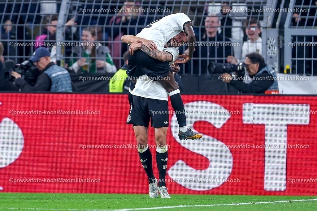 DFB23032501062 | 23.03.2025, Fußball, Viertelfinale UEFA Nations League, Deutschland - Italien, Signal Iduna Park, Saison 2024 2025: Torjubel nach dem Tor zum 3:0 durch Torschütze Tim Kleindienst (GER #09) zusammen mit Antonio Rüdiger (GER #02) DFB regulations prohibit any use of photographs as image sequences and or quasi-video.