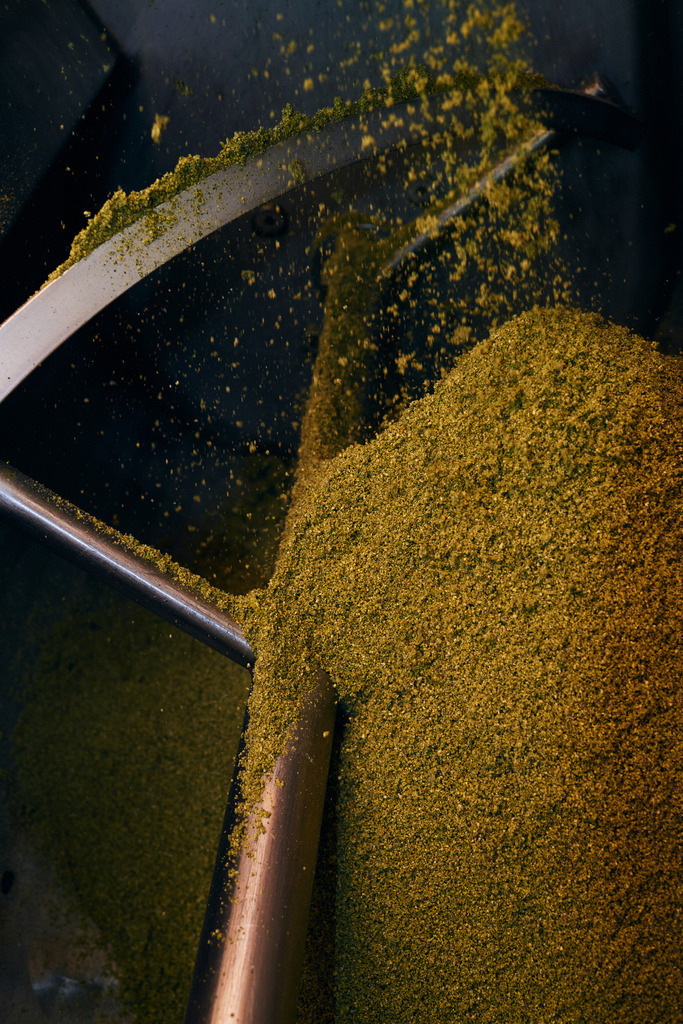 Die Ölmühle | Markt Allhau, Austria - February 09, 2018: Die Ölmühle; gemahlene Kürbiskerne werden mit Wasser zu einem Brei vermischt. - Realisiert mit Pictrs.com