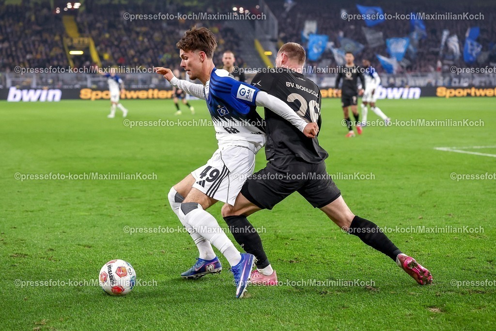 BVB21032601103 | 21.03.2026, Fußball, Borussia Dortmund - Hamburger SV, 1. Fußball Bundesliga, 27. Spieltag, Signal Iduna Park, Saison 2025 2026: Julian Ryerson&nbsp;(BVB #26) im Zweikampf gegen  Otto Stange&nbsp; (HSV #49)  DFB regulations prohibit any use of photographs as image sequences and or quasi-video.