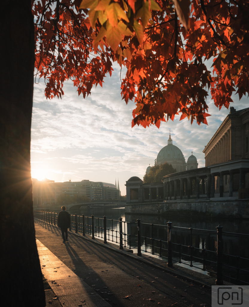 Autumn stroll into the weekend  | The Berlin Cathedral stands majestic, surrounded by vibrant red leaves glowing in the gentle backlight of golden hour. An absolutely fantastic moment as the city is bathed in warm autumn light, with nature showing off its most beautiful colors.  Berlin in autumn is simply magical! 