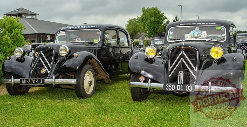 Citroën Traction Avant vintage cars at classic car show | Two black Citroën Traction Avant classic cars parked on grass during a vintage car event - Realized with Pictrs.com