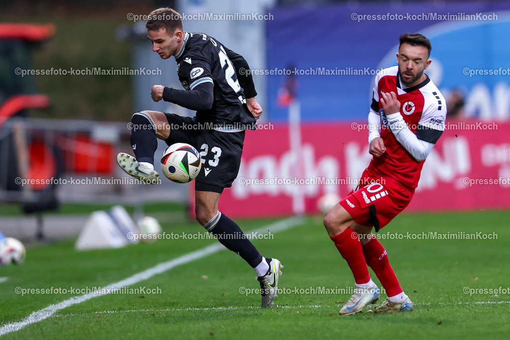FCVK21122401016 | 21.12.2024, Fußball, FC Viktoria Köln – SV Sandhausen, 3.Liga, Sportpark Höhenberg, Saison 2024 2025: Niklas Lang (Sandhausen #23) im Zweikampf gegen Albion Vrenezi (Viktoria Köln #10)DFB regulations prohibit any use of photographs as image sequences and or quasi-video.
