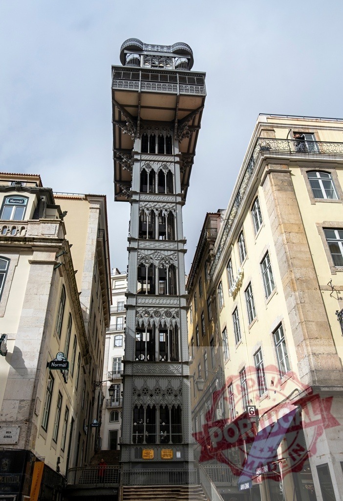 Santa Justa Lift iron gothic revival landmark in Lisbon | Santa Justa Lift standing between old commercial buildings, connecting lower and upper city areas - Realized with Pictrs.com