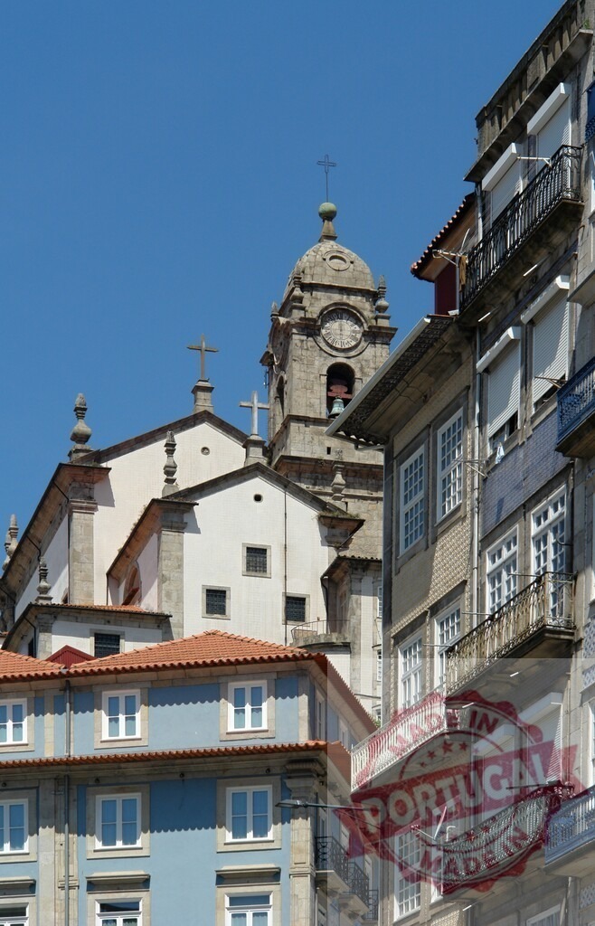 Traditional architecture Porto Portugal church bell tower and buildings. Porto - Portugal | Classic Portuguese city architecture featuring a historic bell tower, church, and residential buildings under a clear sky - Realisiert mit Pictrs.com
