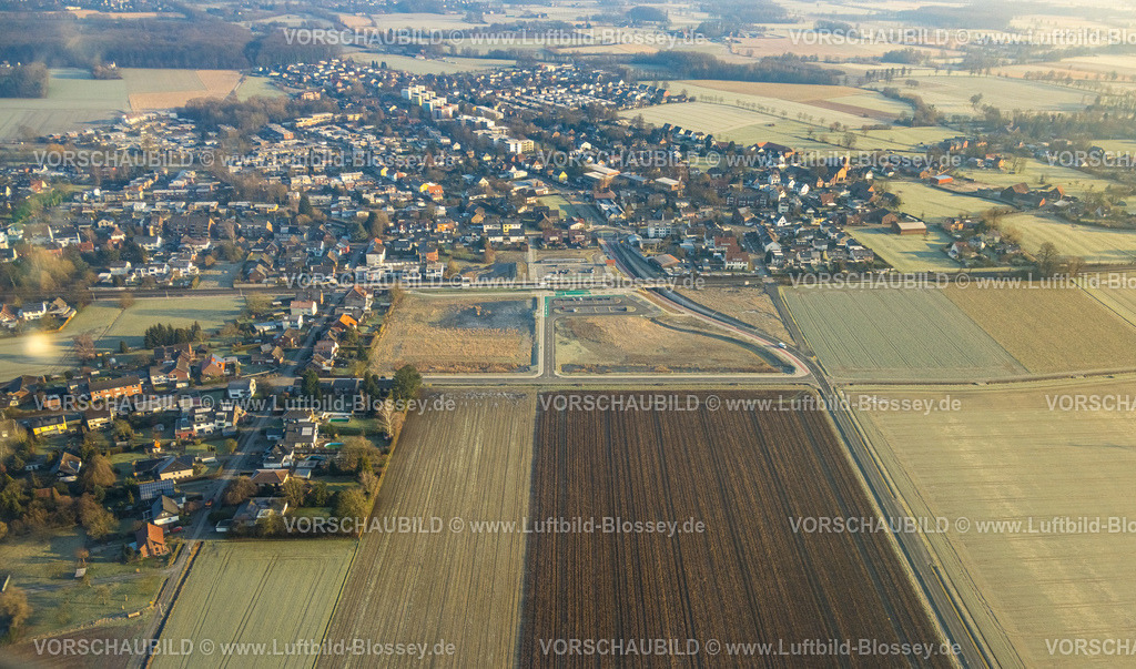Hamm250200503Rhynern | Luftbild, geplante Nahverkehrsverbindung mit Haltepunkt in Westtünnen, Südfeldweg, Baustelle am Südfeldweg und Von-Thünen-Straße für den künftigen Bahnhaltepunkt, Bahnlinie mit Eisenbahnbrücke und Wohnsiedlung mit Kreisverkehr, Parkplätze, Stadtbezirk Rhynern, Hamm, Ruhrgebiet, Nordrhein-Westfalen, Deutschland