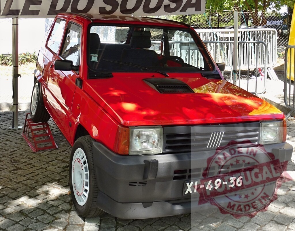 Red Fiat Panda 4x4 Sisley parked on display | Classic red Fiat Panda 4x4 Sisley parked on display at a car show - Realized with Pictrs.com
