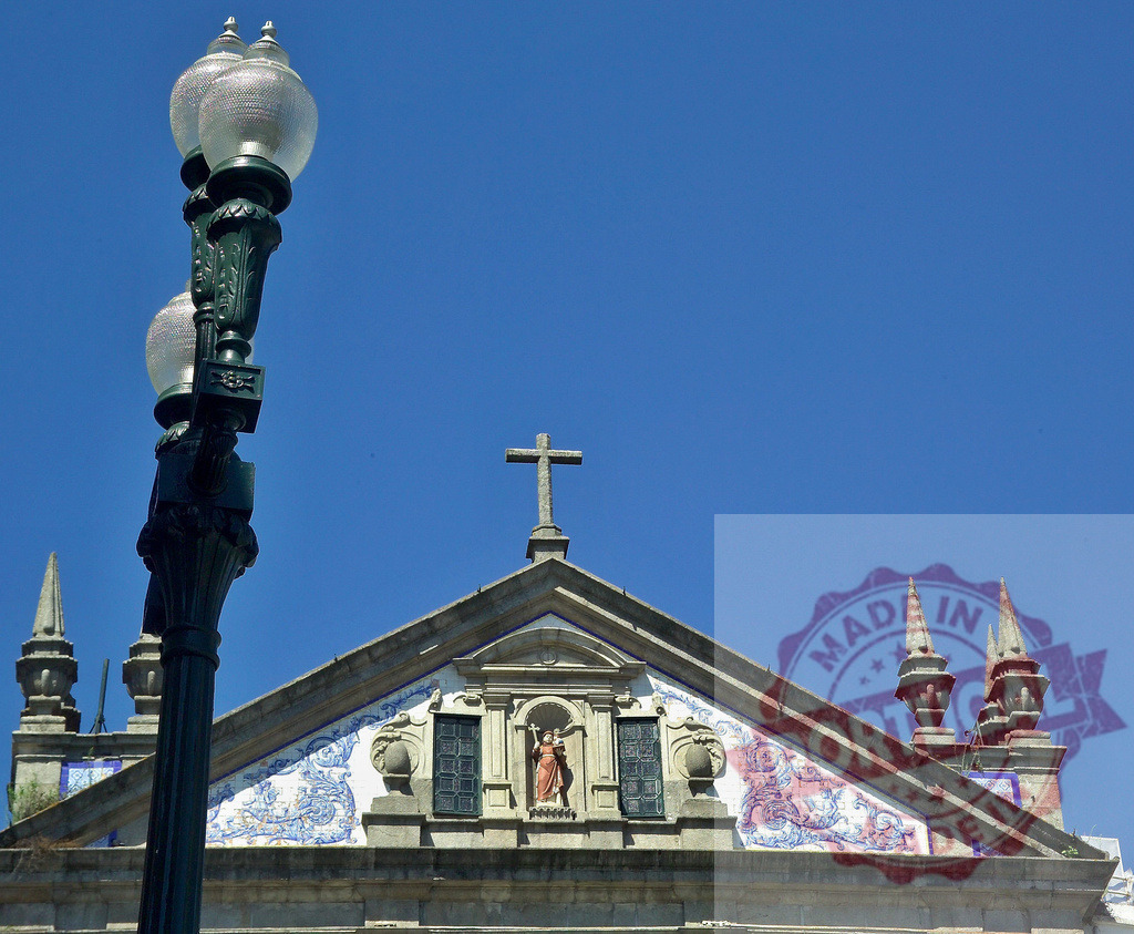 Church of Saint Francis facade with lamppost in Porto | Ornate azulejos decorating a historic church facade in Porto under a clear blue sky - Realized with Pictrs.com