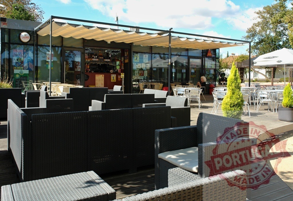 Outdoor cafe terrace with modern wicker furniture seating | Empty outdoor cafe terrace preparing for customers enjoying leisure time - Realisiert mit Pictrs.com