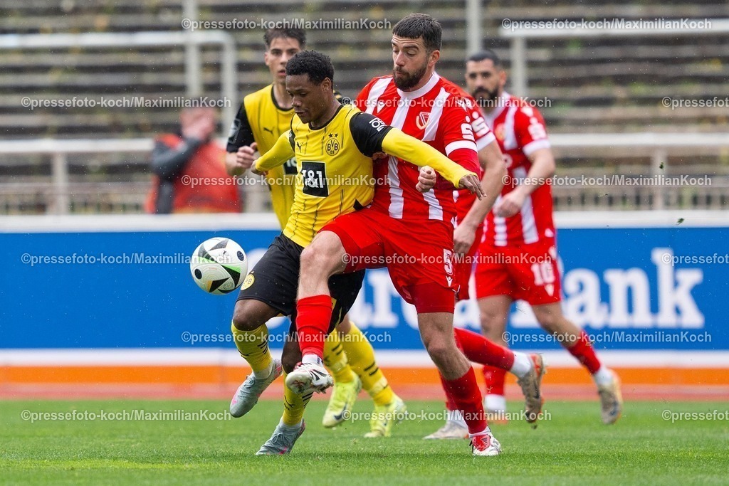 xydr13042501036 | 13.04.2025, xydrx, Fußball, Borussia Dortmund II - FC Energie Cottbus, 3.Liga, Stadion Rote Erde, Saison 2024 2025: Julien Duranville (Borussia Dortmund II #18) im Zweikampf gegen Dominik Pelvian (FC Energie Cottbus #5) DFB regulations prohibit any use of photographs as image sequences and or quasi-video.