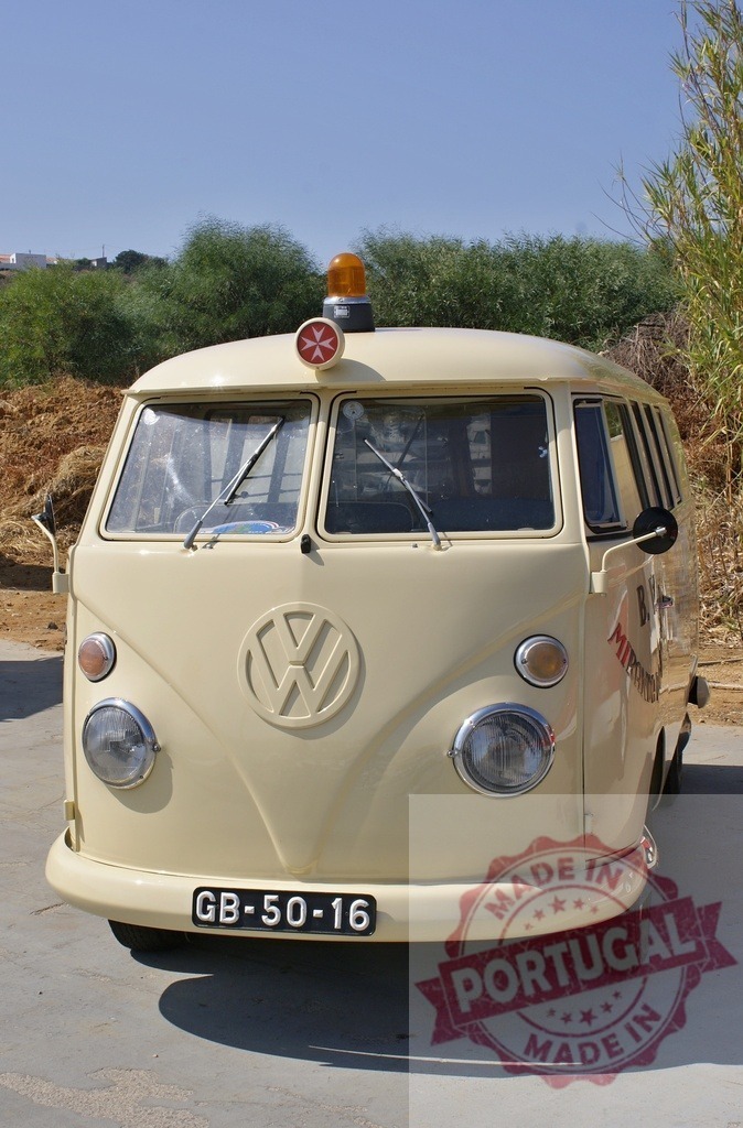 Volkswagen Type 2 vintage medical van front view | Cream colored Volkswagen Type 2 van with a Maltese cross and beacon on roof - Realized with Pictrs.com