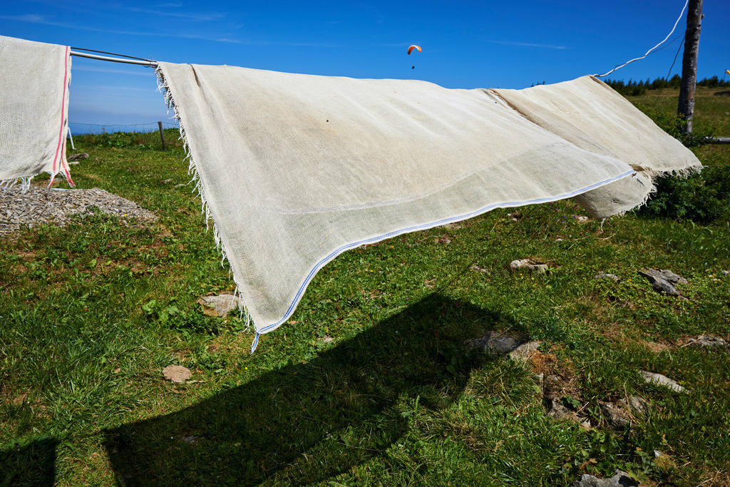 aufgehaengtes Kaesertuch | Bezau, Austria - July 31, 2015: Zum trocknen aufgehaengtes Kaesertuch. - Realisiert mit Pictrs.com
