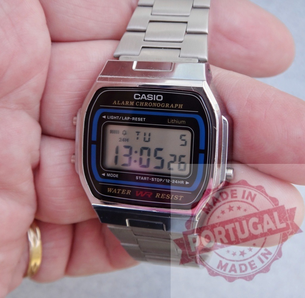 Hand wearing Casio vintage digital watch with metal strap | Human hand showing a classic Casio digital watch with a shiny stainless steel band - Realized with Pictrs.com