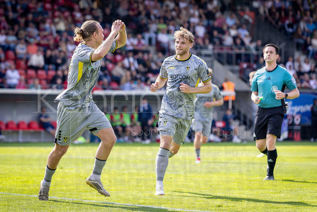 German 3rd Division, Viktoria Koeln vs. Alemannia Aachen, 10.05.2026 | KOELN, GERMANY - MAY 10, 2026: Lars Gindorf (Alemannia Aachen, 23) celebrates scoring his team's second goal with teammates during the 3rd division match on gameday 37 between Viktoria Koeln vs. Alemannia Aachen at the Sportpark Hoehenberg on May 10, 2026 in Koeln, Germany. DFL REGULATIONS PROHIBIT ANY USE OF PHOTOGRAPHS AS IMAGE SEQUENCES AND/OR QUASI-VIDEO.